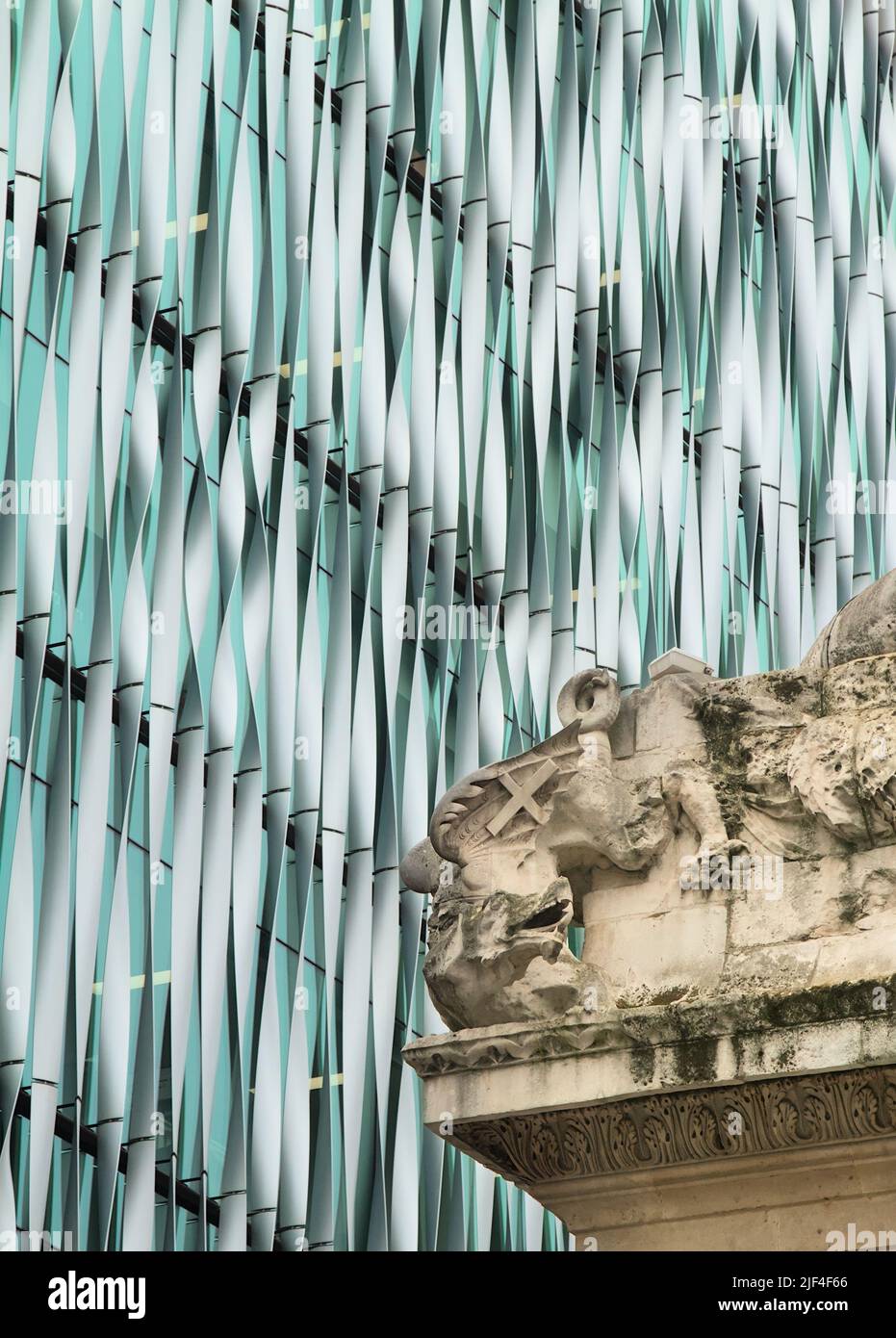 Old And New Contrast Of Part Of The Monument To The Great Fire Of London And The Front Of A Modern Office Building, London UK Stock Photo