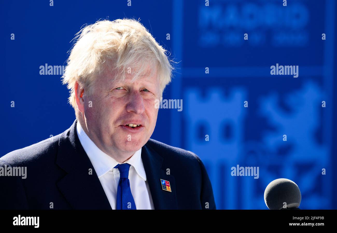 Madrid, Spain. 29th June, 2022. Boris Johnson, Prime Minister of the United Kingdom, speaks after his arrival at the NATO summit in Madrid. At the two-day summit, the heads of state and government of the 30 alliance states are to take decisions on the implementation of the 'NATO 2030' reform agenda. Credit: Bernd von Jutrczenka/dpa/Alamy Live News Stock Photo