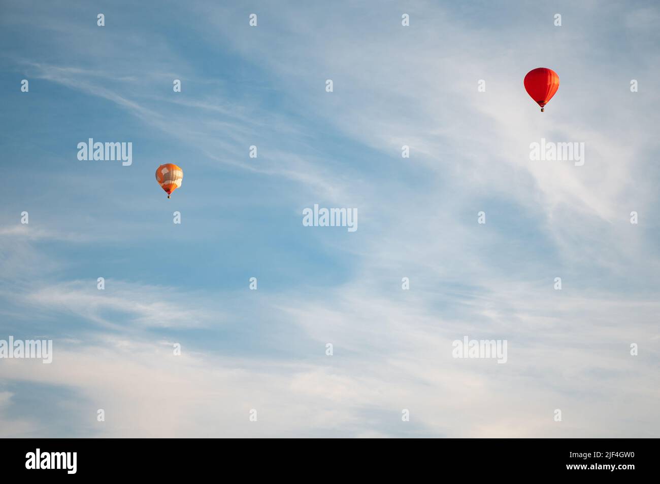Colorful hot air balloons in blue sky at summer day Stock Photo - Alamy