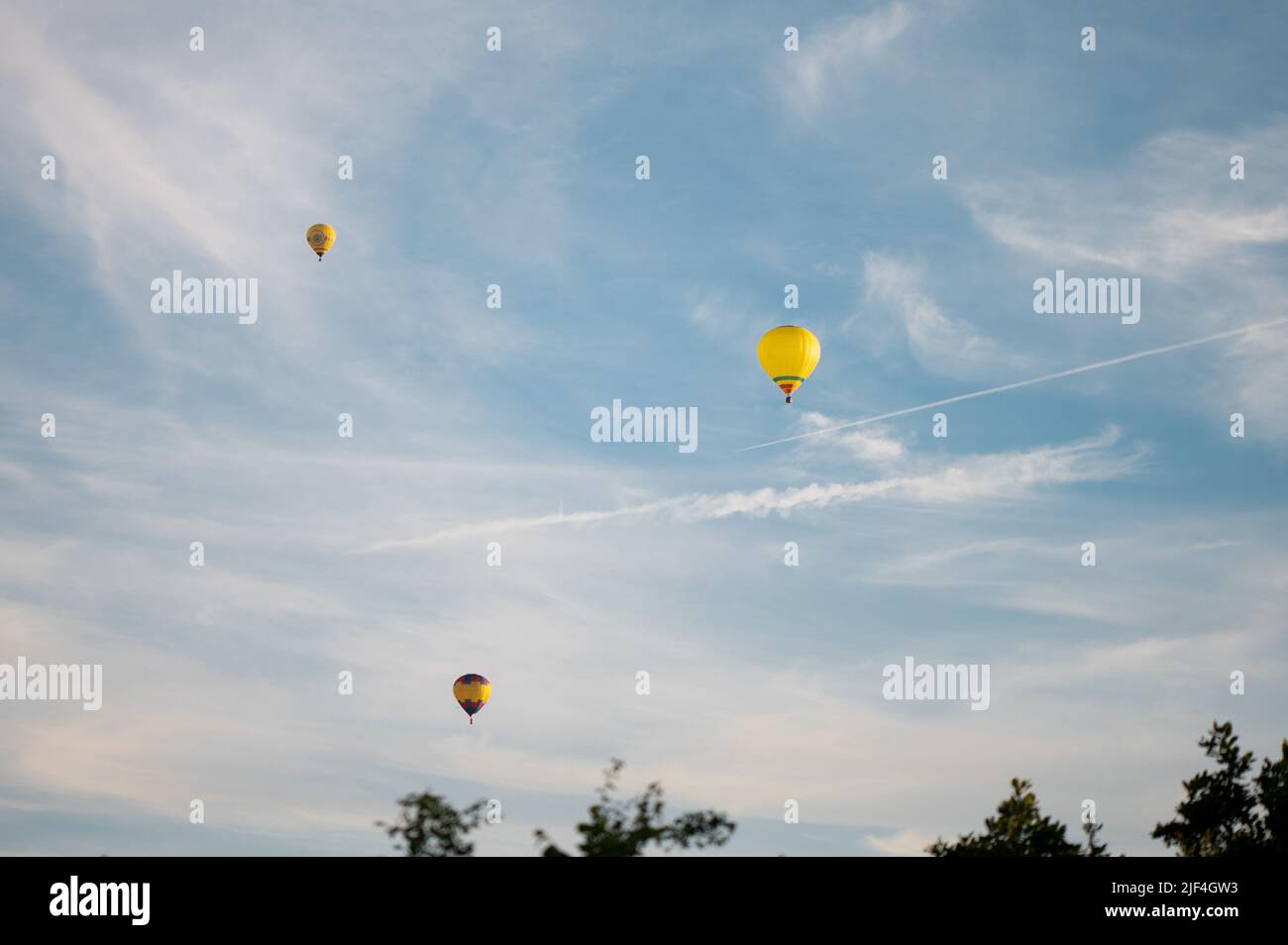Colorful hot air balloons in blue sky at summer day Stock Photo - Alamy