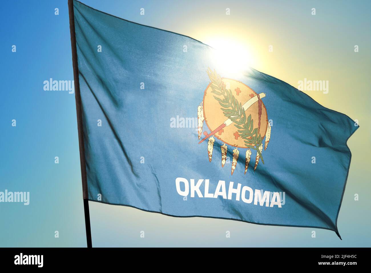 Oklahoma state of United States flag waving on the wind Stock Photo