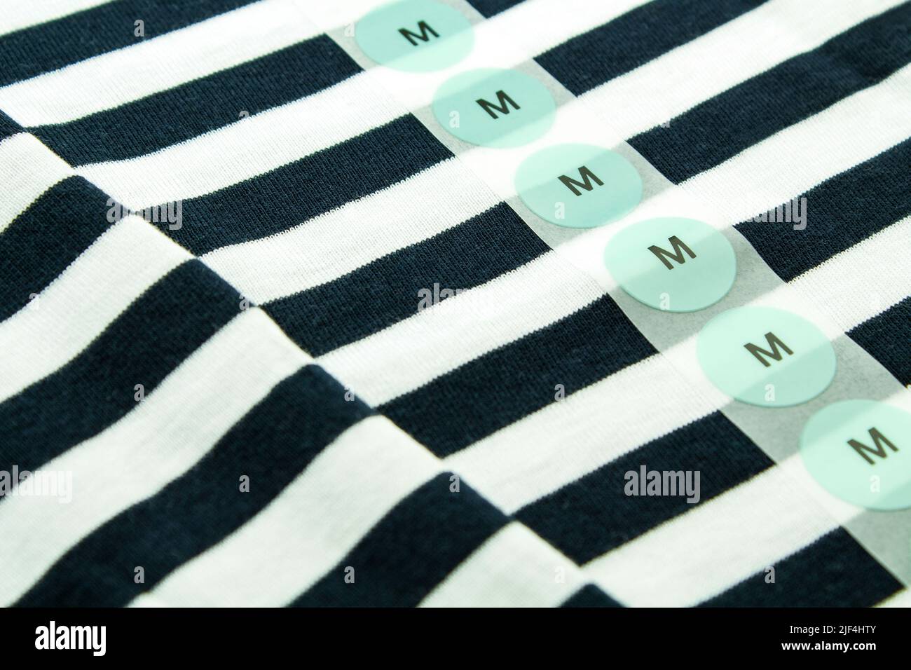 T-Shirt and label size M close up Stock Photo