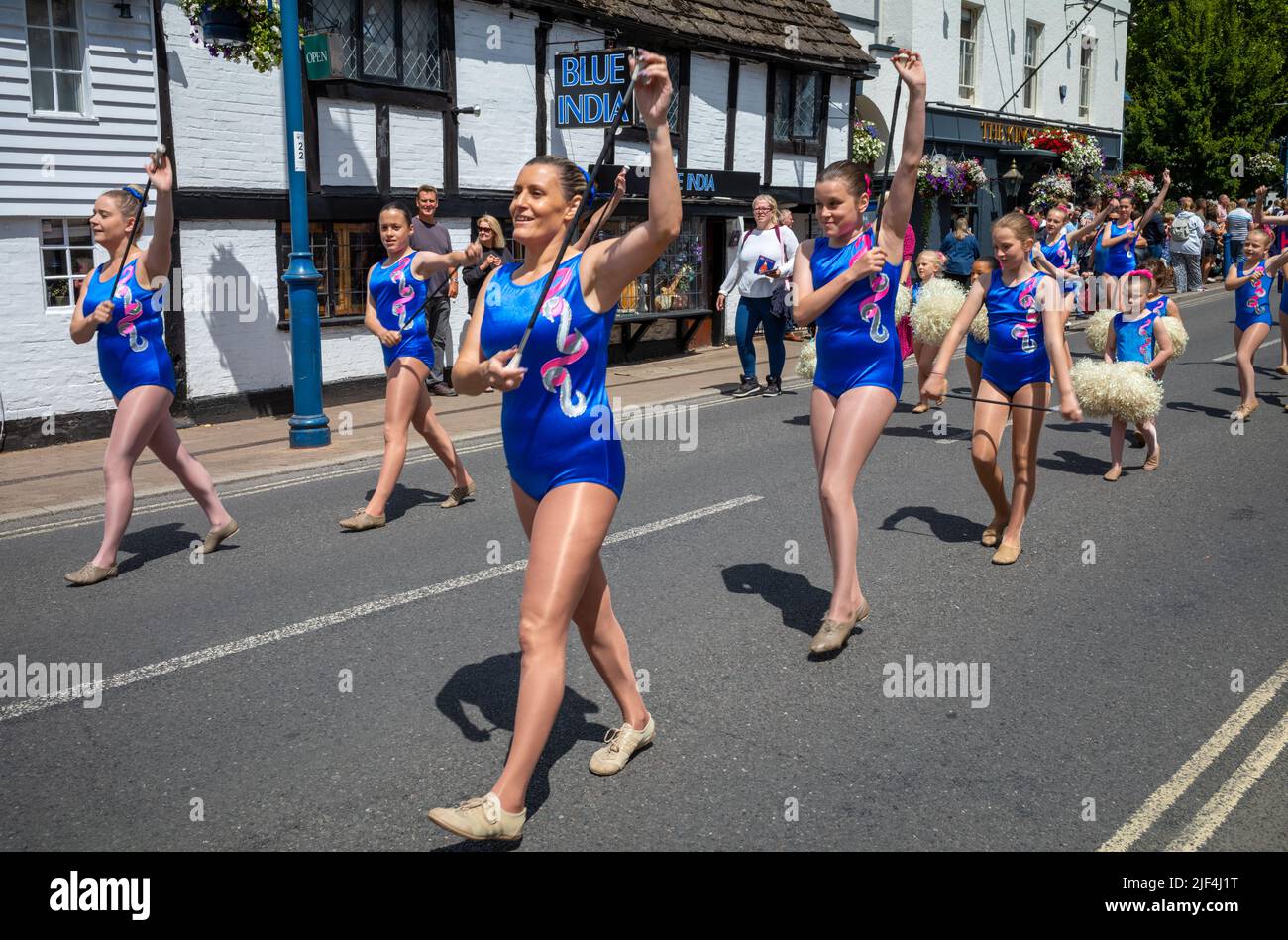 The Horsham Bluebelles Baton Twirlers parade through Billingshurst High Street as part of the annual Billingshurst Show. Stock Photo