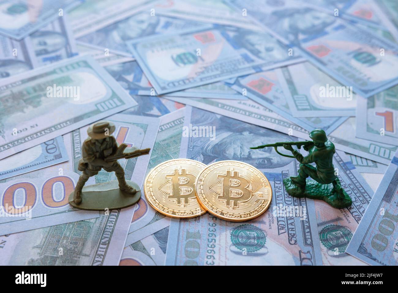 War crimes in black market with using cryptocurrency or bitcoin concept  photo. Two bitcoins on the US dollars with figure soldiers Stock Photo -  Alamy