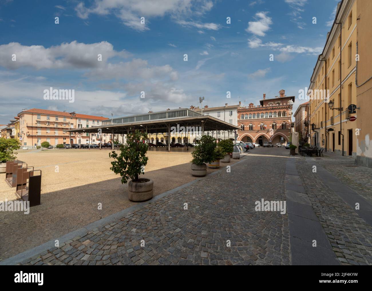 Cuneo, Italy, - June 27, 2022: piazza Vincenzo Virginio, former wine market square, with covered fruit and vegetable market, metal canopy from 1934 (e Stock Photo