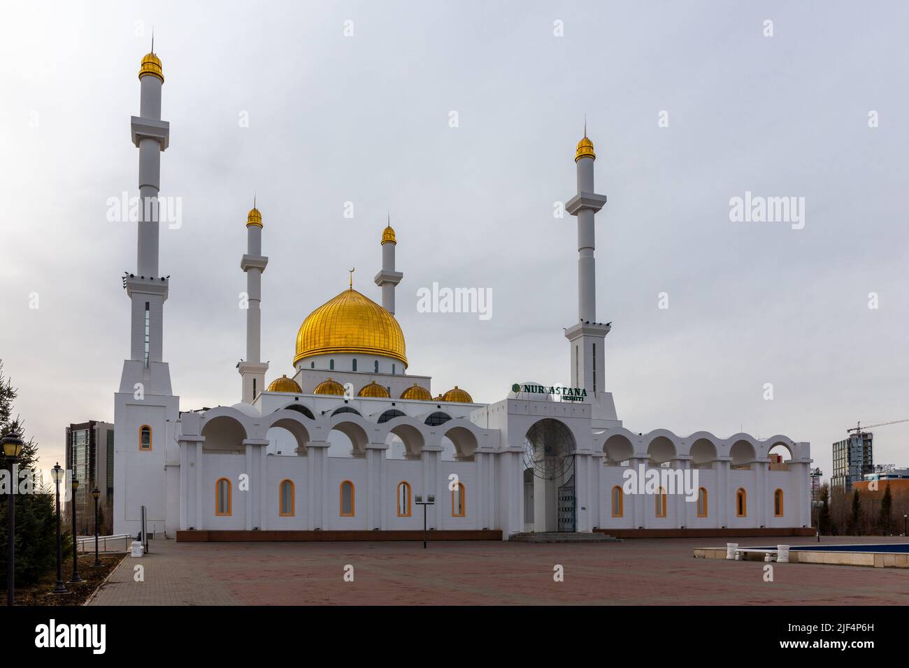 Nur Astana Mosque (Nur Astana Meshiti) in Nur Sultan, Kazakhstan, with white facade and golden dome and ornaments. Stock Photo