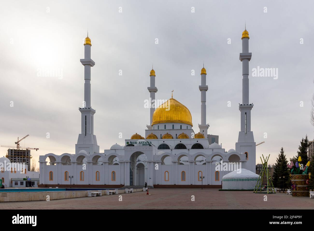 Nur Astana Mosque (Nur Astana Meshiti) in Nur Sultan, Kazakhstan, with white facade and golden dome and ornaments. Stock Photo
