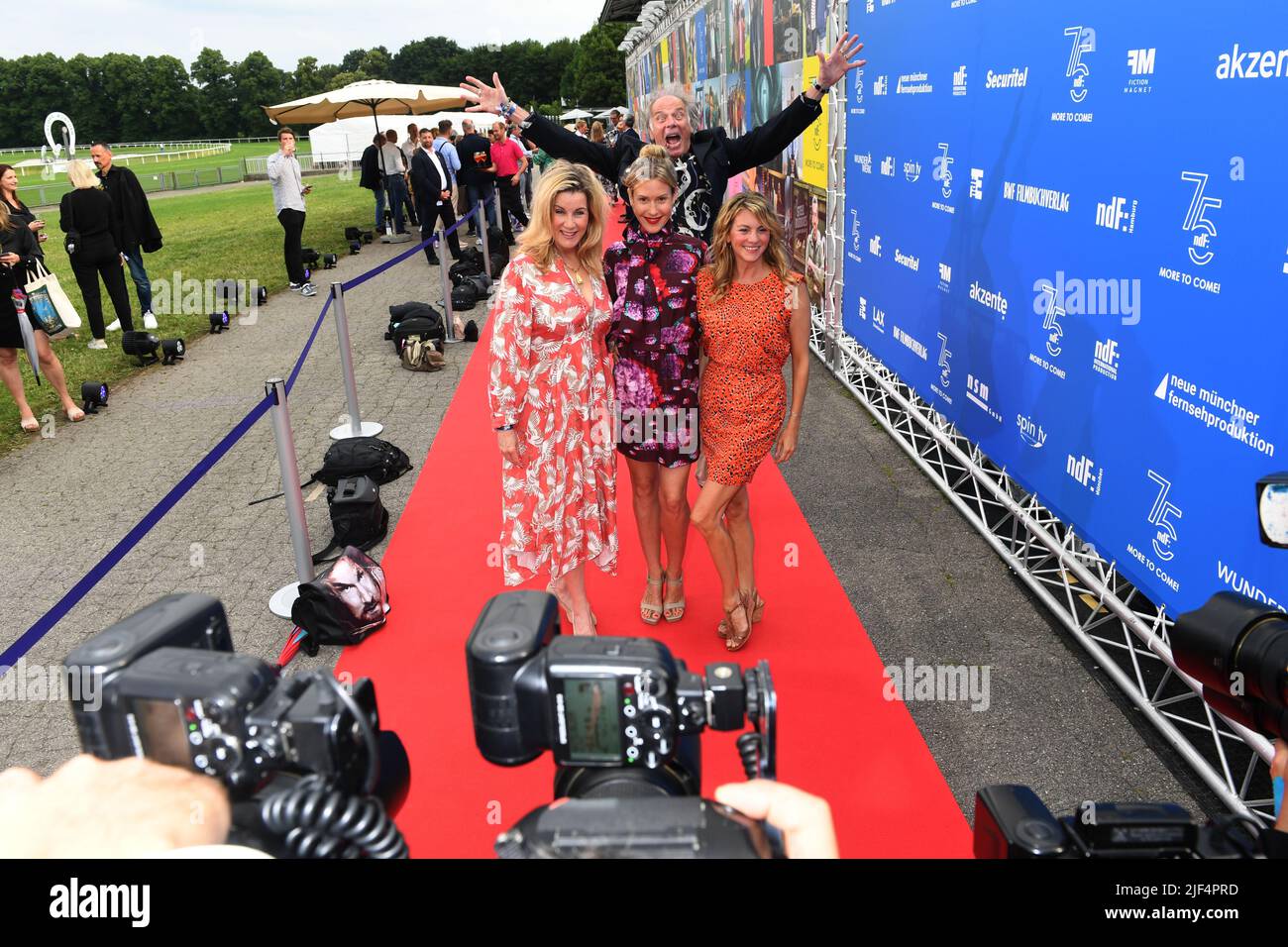 Munich, Germany. 29th June, 2022. Actor Wolfgang Fierek (back) and actress Alexa Maria Surholt (l-r) actress Wolke Hegenbarth and actress Luise Bähr arrive at the '75 Years of ndF' event taking place at the Riem racecourse as part of the Munich Film Festival. The new German Film Company Ltd (ndF) is celebrating its 75th anniversary this year. Credit: Felix Hörhager/dpa/Alamy Live News Stock Photo