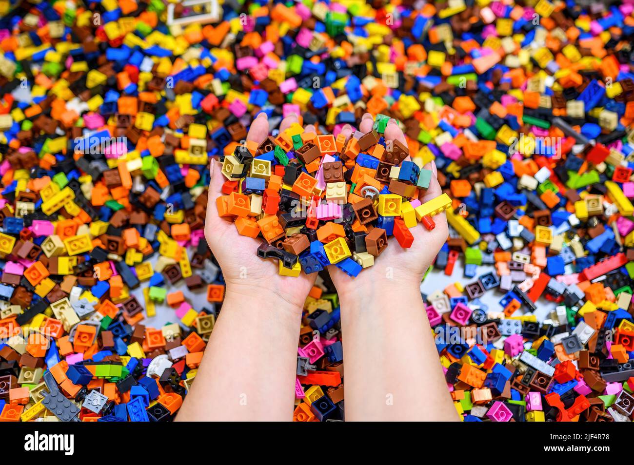 Plastic toy blocks on white background Stock Photo - Alamy