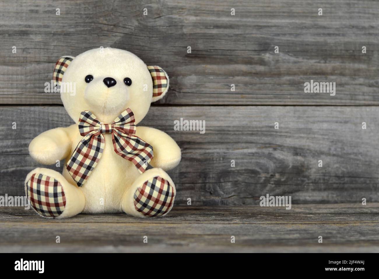 Teddy bear soft toy on wooden background with copy space Stock Photo ...