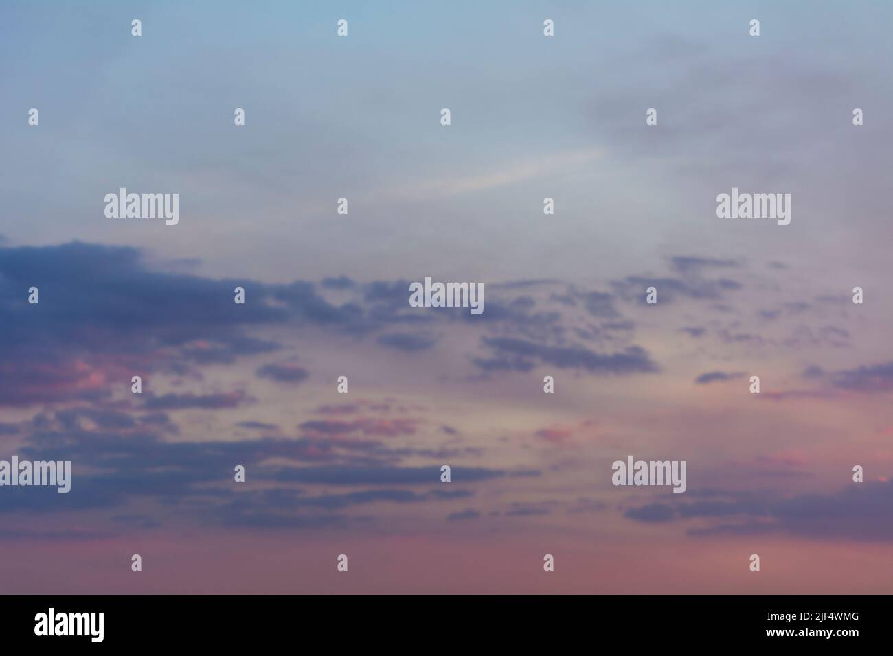 Sunset illuminating the cloudy sky Stock Photo - Alamy