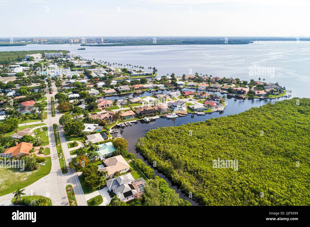 Fort Ft. Myers Florida,Palm Acres development houses homes neighborhood encroachment,Caloosahatchee River wetlands Iona Cove,aerial overhead view from Stock Photo