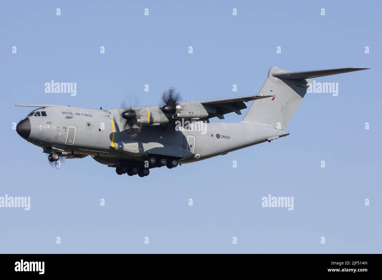 A Royal Air Force Airbus A400M military cargo aircraft landing in Graz in Austria in front of blue skies Stock Photo