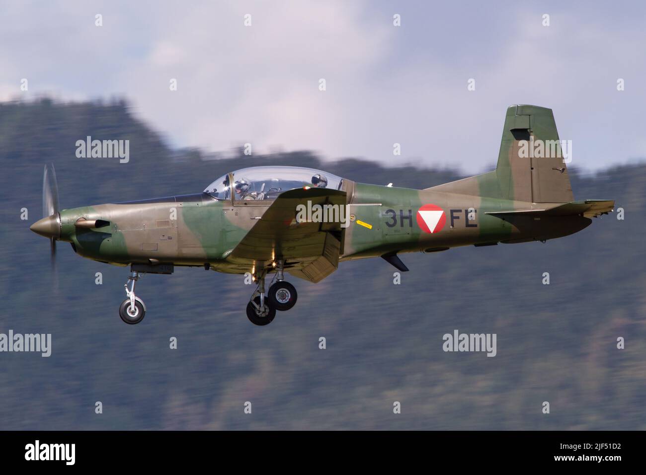 A Pilatus PC-7 training aircraft of the Austrian Air Force coming in for landing in Zeltweg in Austria Stock Photo