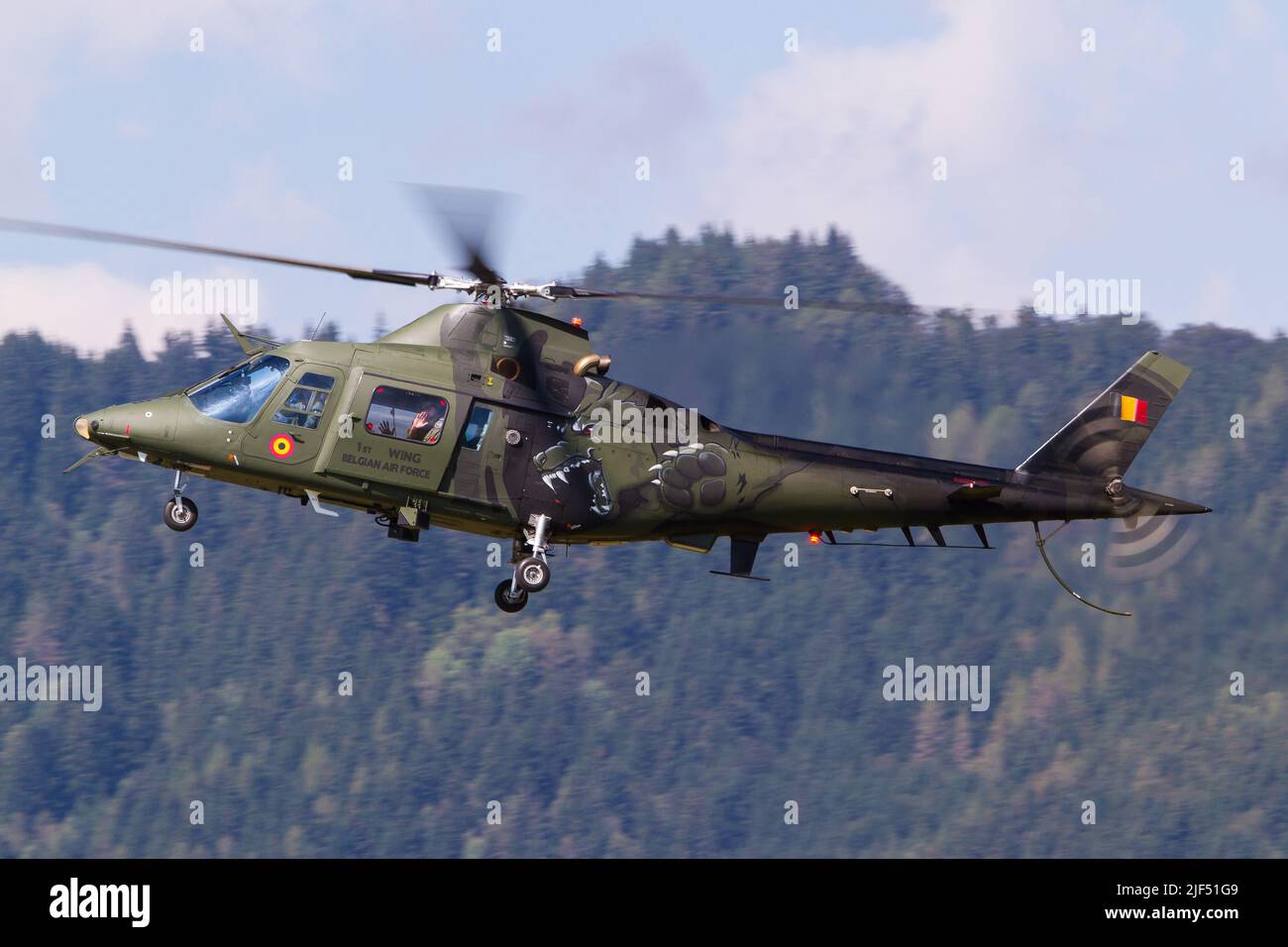 A Belgian Air Force A109 combat helicopter coming in for landing Stock Photo