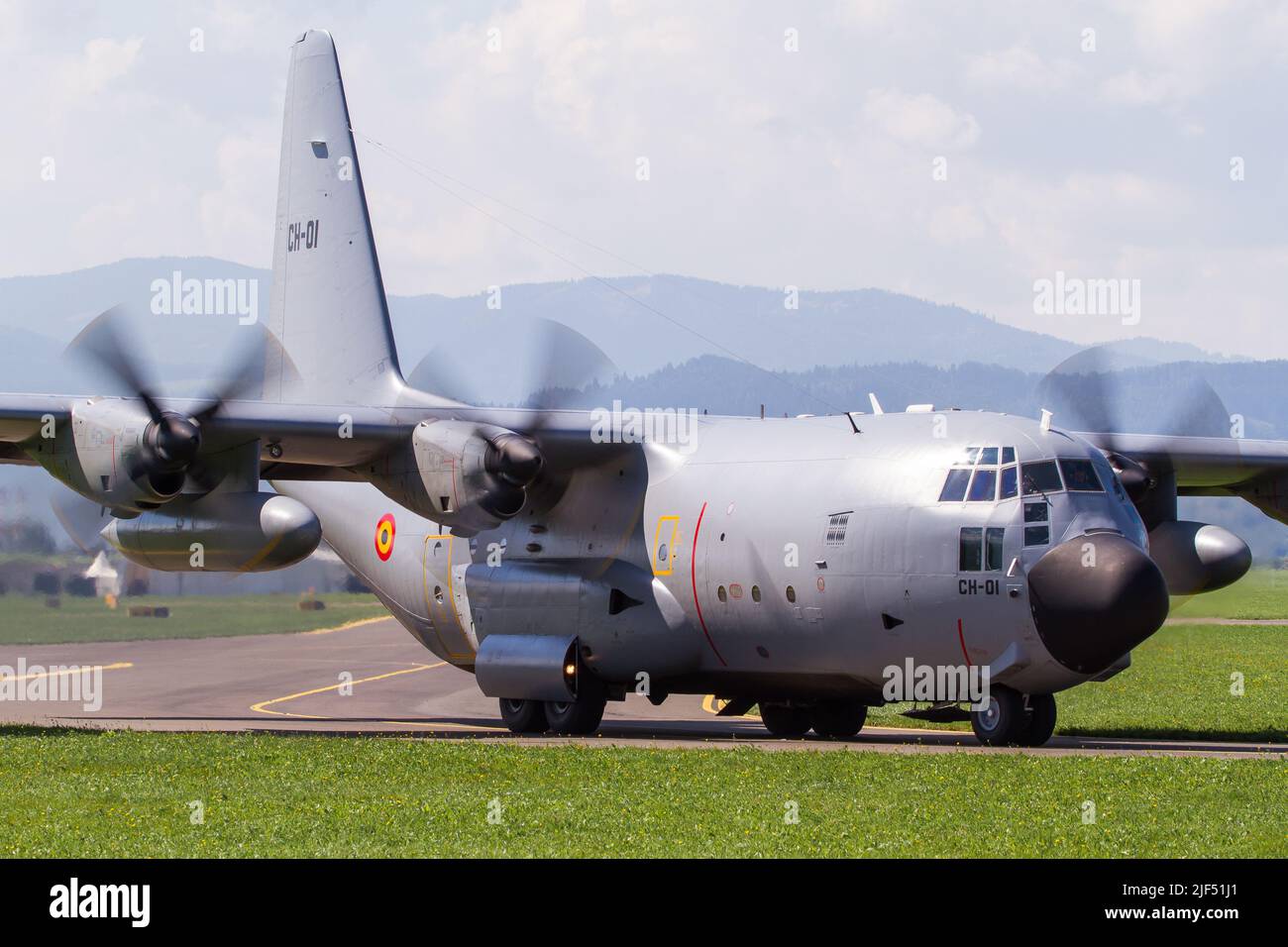 A Spanish Air Force Hercules military transport aircraft taxiing at airbase Zeltweg in Austria to the runway with turning propellers Stock Photo
