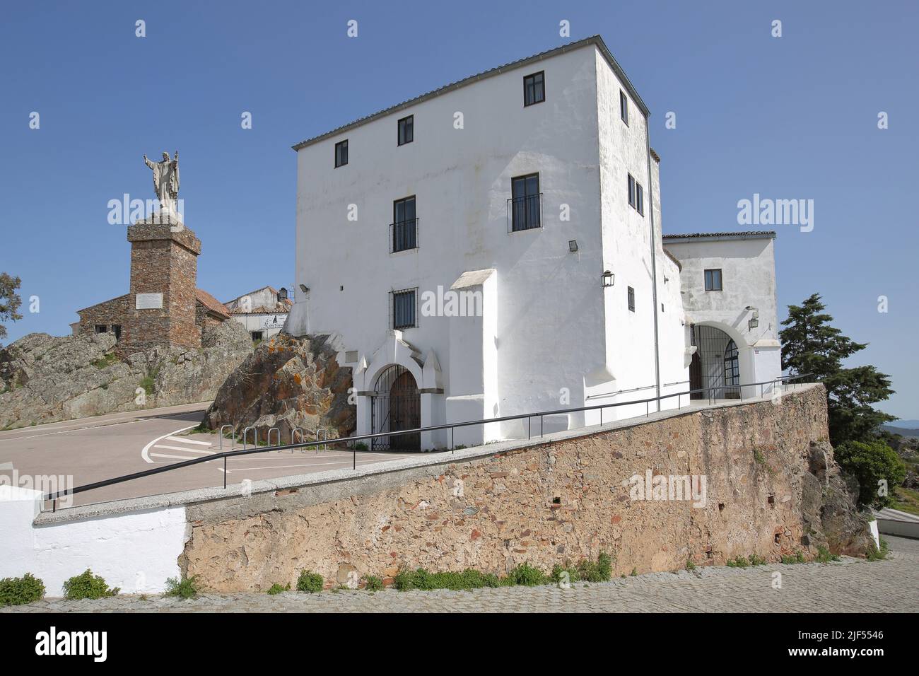 Virgen de la Montana with building and statue of Jesus in Caceres