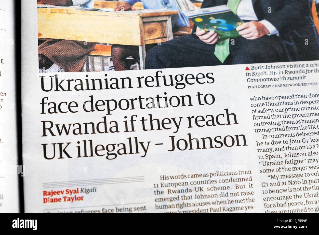 'Ukrainian refugees face deportation to Rwanda if they reach UK illegally - Johnson' Guardian newspaper immigration clipping 23 June 2022 London UK Stock Photo