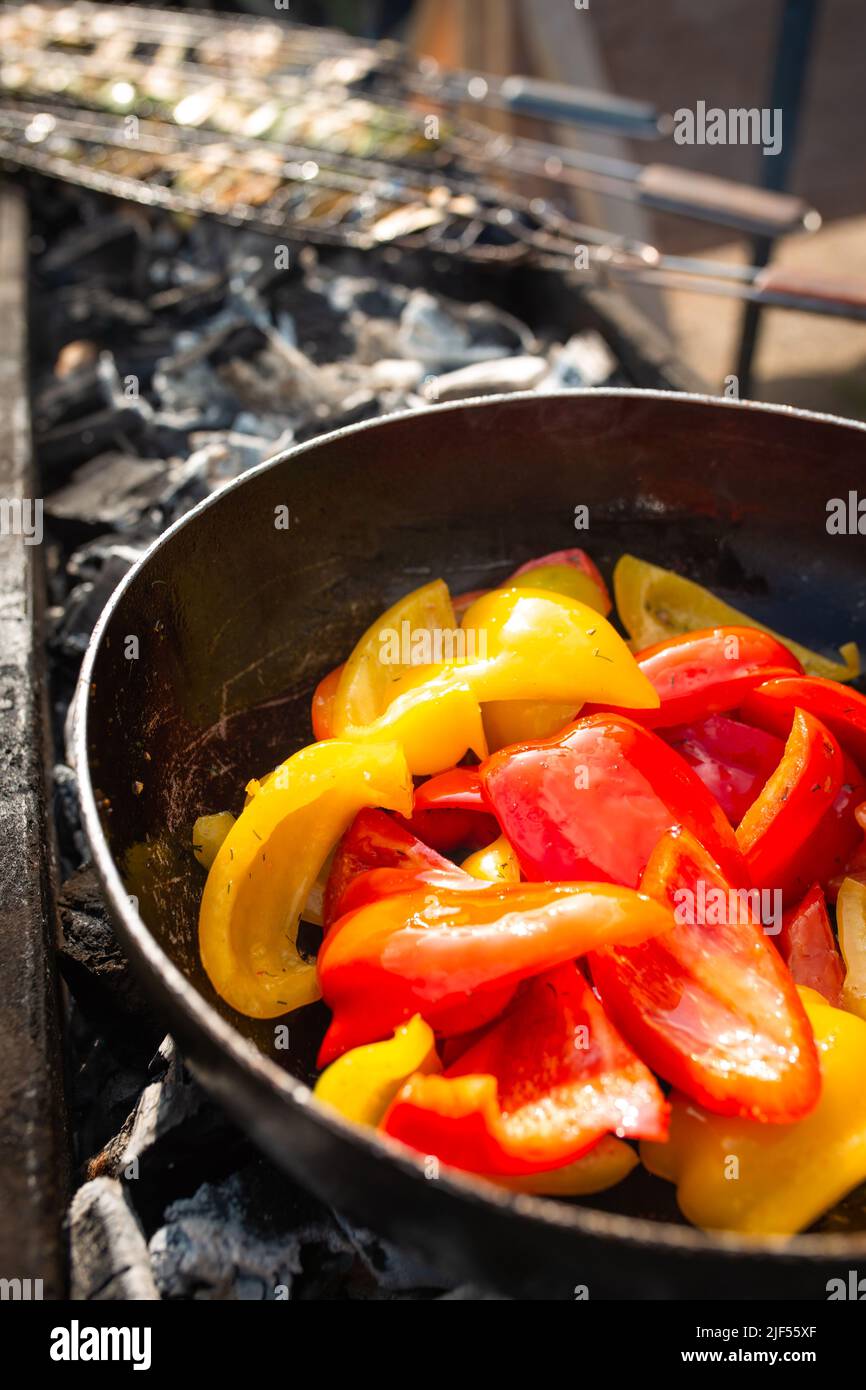 bulgarian pepper is fried on coals. Sweet red pepper on the grill Stock ...