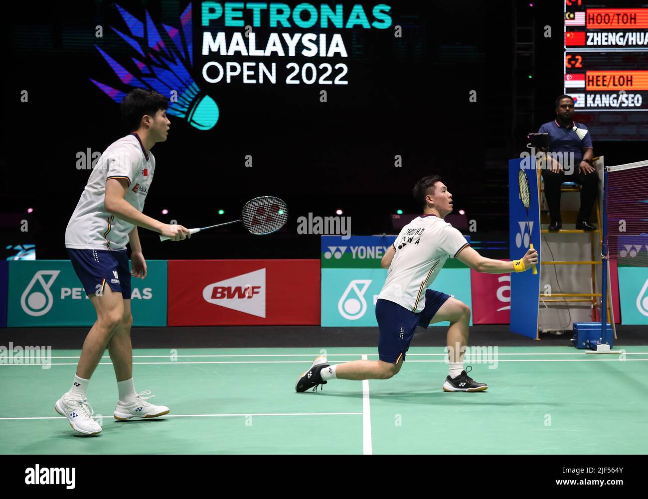 Kuala Lumpur, Malaysia. 29th June, 2022. He Ji Ting and Zhou Hao Dong of China play against Boon Xin Yuan and Wong Tien CI of Malaysia during the Men's Doubles round one match of the Petronas Malaysia Open 2022 at Axiata Arena, Bukit Jalil. Credit: SOPA Images Limited/Alamy Live News Stock Photo