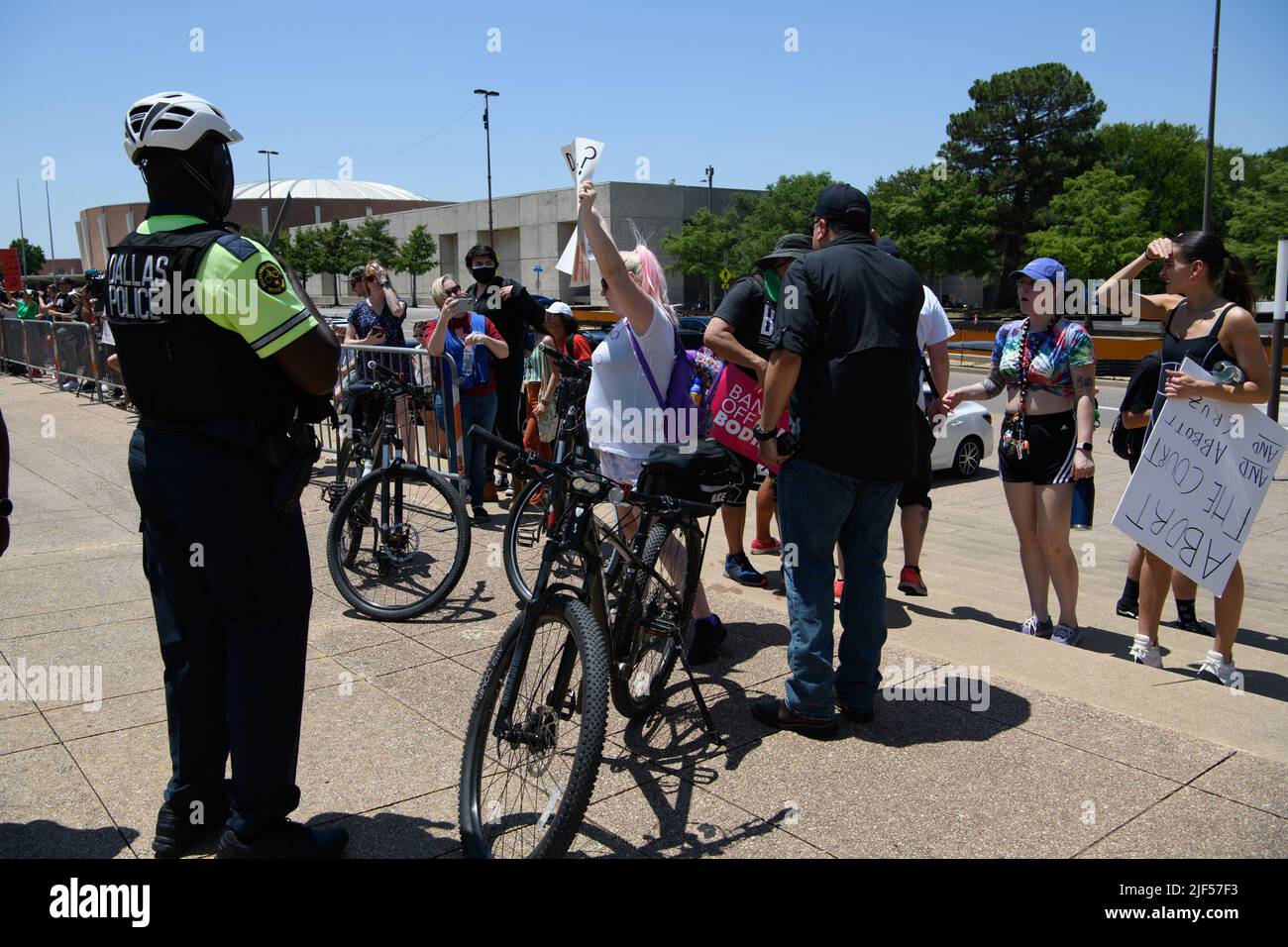 June 29, 2022, Dallas City Hall, Dallas, Texas: During the Dallas Reproductive Rights Rally at Dallas City Hall, several anti-abortion protesters started to harass the event participants. Dallas Police Dept. officers moved the protesters to a fenced area near the plaza's flagpoles, and bicycle cops blocked entry.After about 30 minutes of pro-abortion protesters sharing their opinions of religious protesters, the police escorted them off the plaza.Participants started to follow them out, and eventually started their march through downtown Dallas starting at AT&T's Discovery Plaza. (Credit Stock Photo