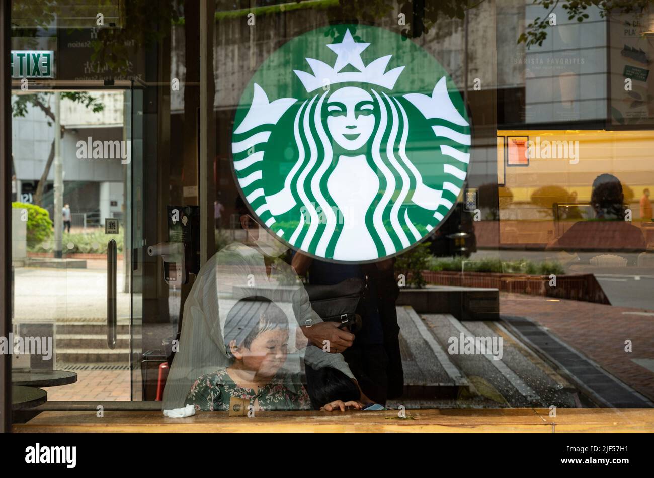 Customers are seen at the American multinational chain Starbucks Coffee