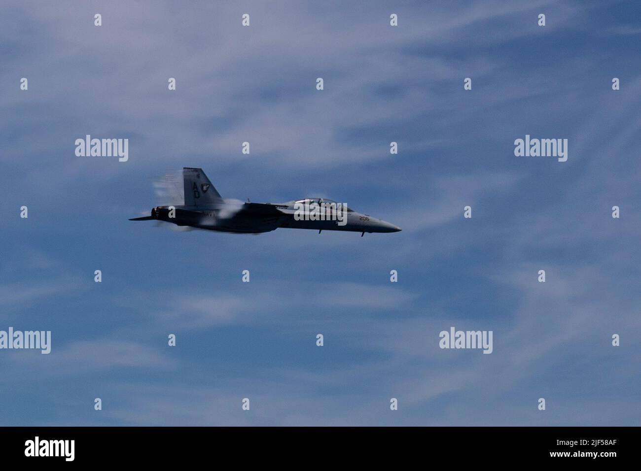 An F/A-18F Super Hornet, attached to the “Blacklions” of Strike Fighter Squadron (VFA) 213 conducts a fly by during USS Gerald R. Ford’s (CVN 78) friends and family day cruise, June 25, 2022. Friends and family members were invited aboard Ford to experience a day in the life of a Sailor at sea first-hand (U.S. Navy photo by Mass Communication Specialist 1st Class Julie R. Matyascik) Stock Photo