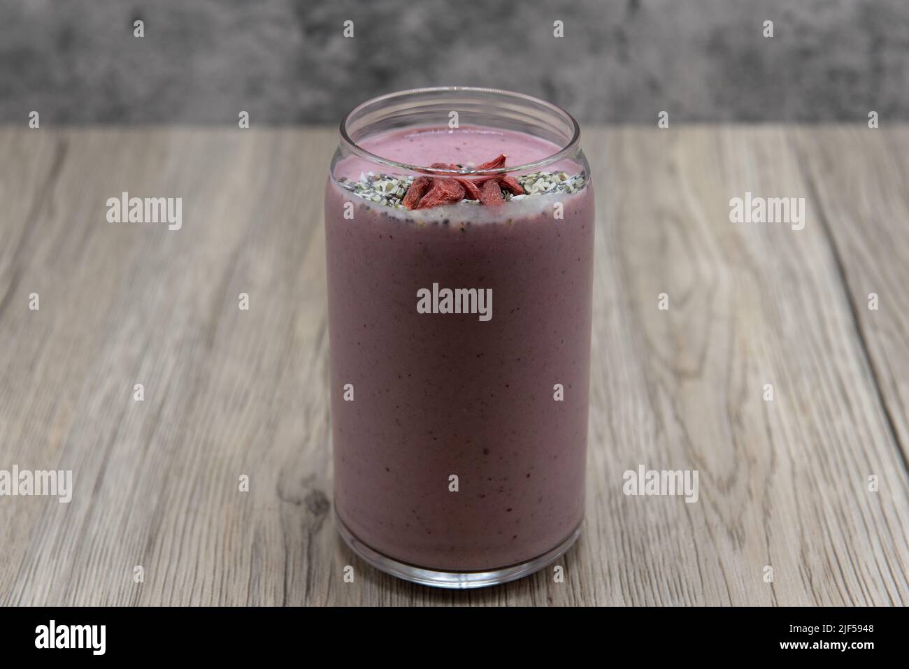 Organic, nutritious, and pink healthy shake smoothie drink topped with