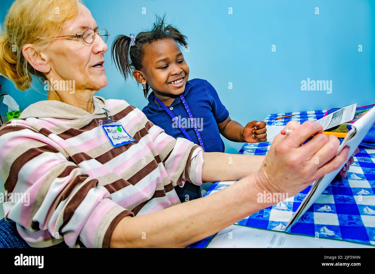 A volunteer tutor works on sight words with a kindergartner at an after-school tutoring center, Feb. 28, 2013, in Columbus, Mississippi. Stock Photo