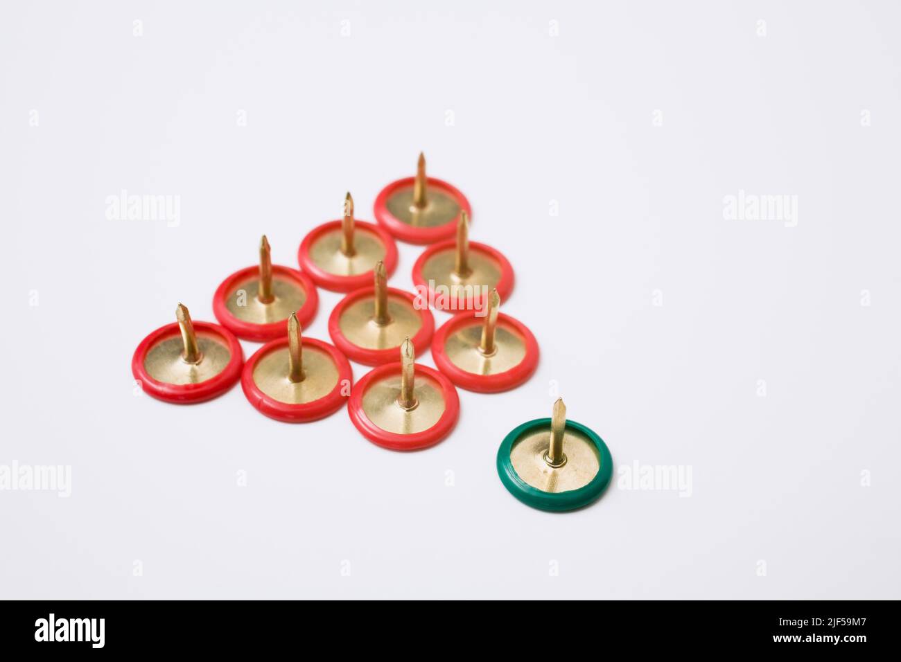 Red and green thumbtacks on white background Stock Photo Alamy