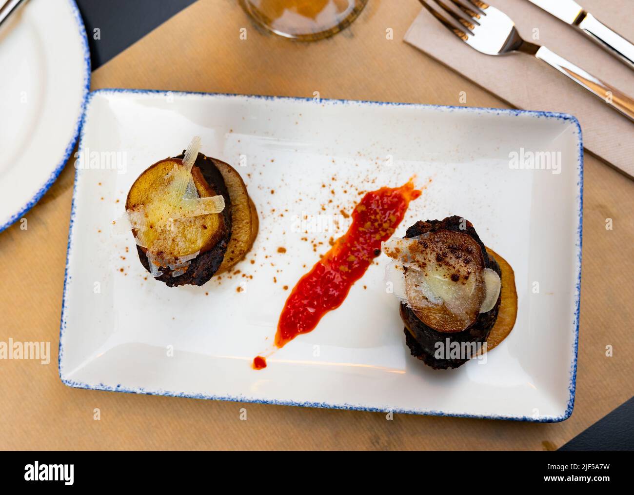 Timbale of pear and cheese blood sausage. Traditional dish for the