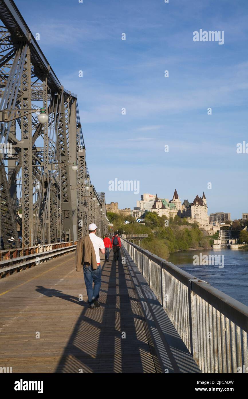 Pedestrians crossing the Alexandra bridge from Hull, Quebec to Ottawa, Ontario, Canada. Stock Photo