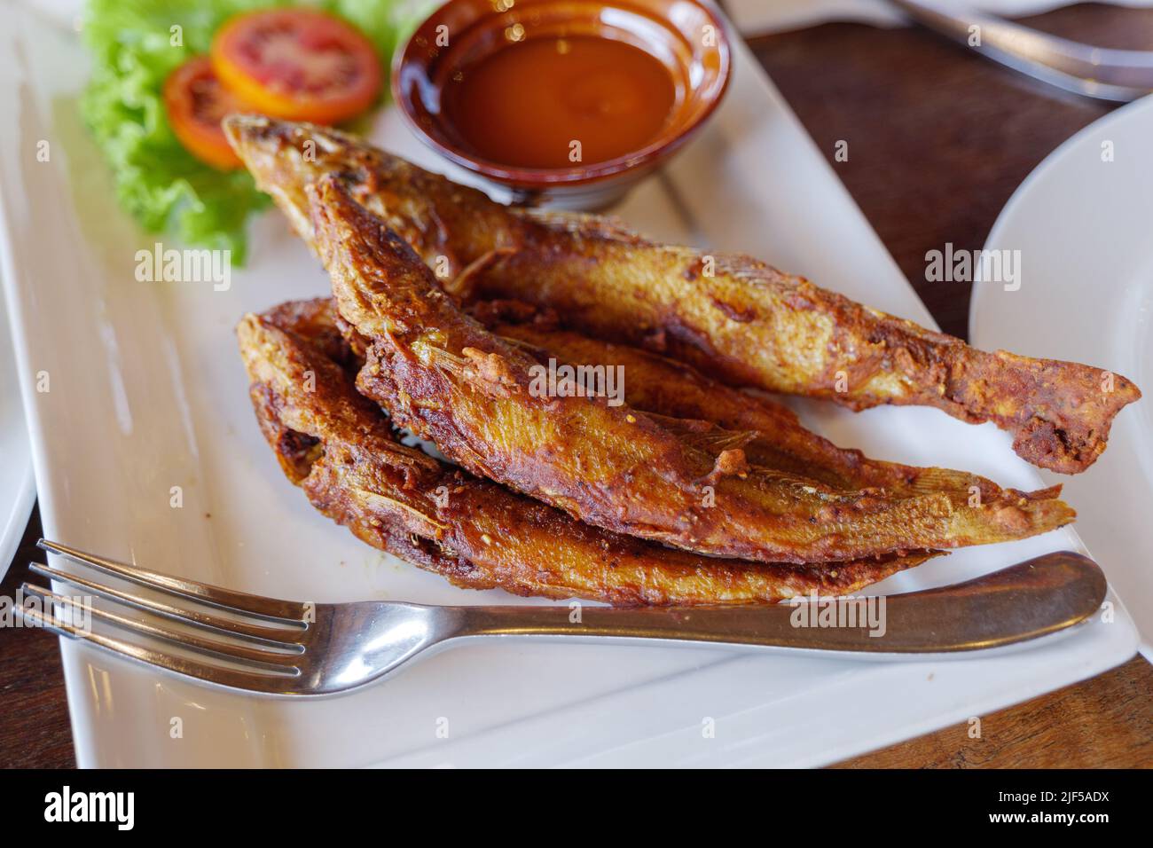 Fried Whiting Fish with Garlic and Turmeric and chilli fish sauce on