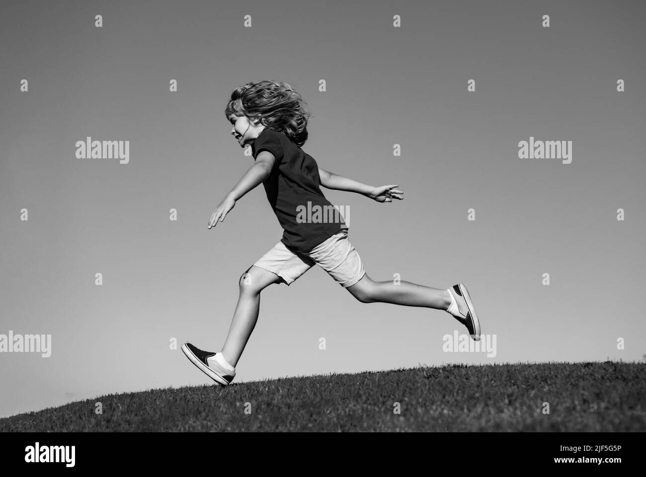 Little cute boy running on grass. Kids exploring nature, summer. Active ...