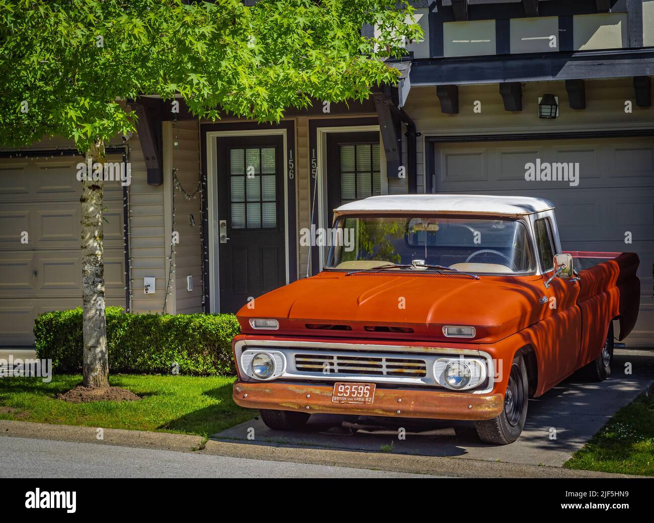 Retro pickup truck on a sunny summer day. Orange Chevrolet C10 Pick Up Truck. Vintage Chevy truck parked on a street-Vancouver BC Canada-June 24,2022. Stock Photo