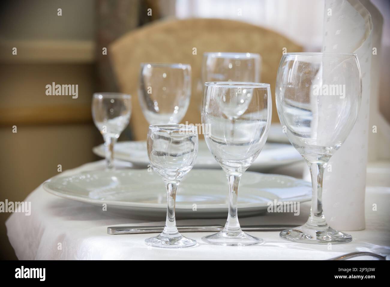 Light picture of empty glasses in restaurant. Mid shot Stock Photo