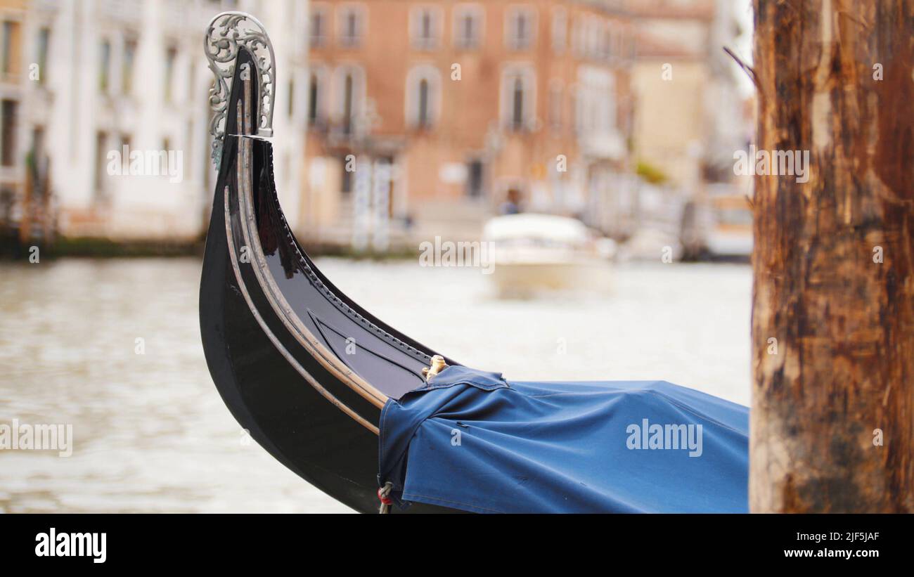 A moored boat on the water channel in Venice. Mid shot Stock Photo