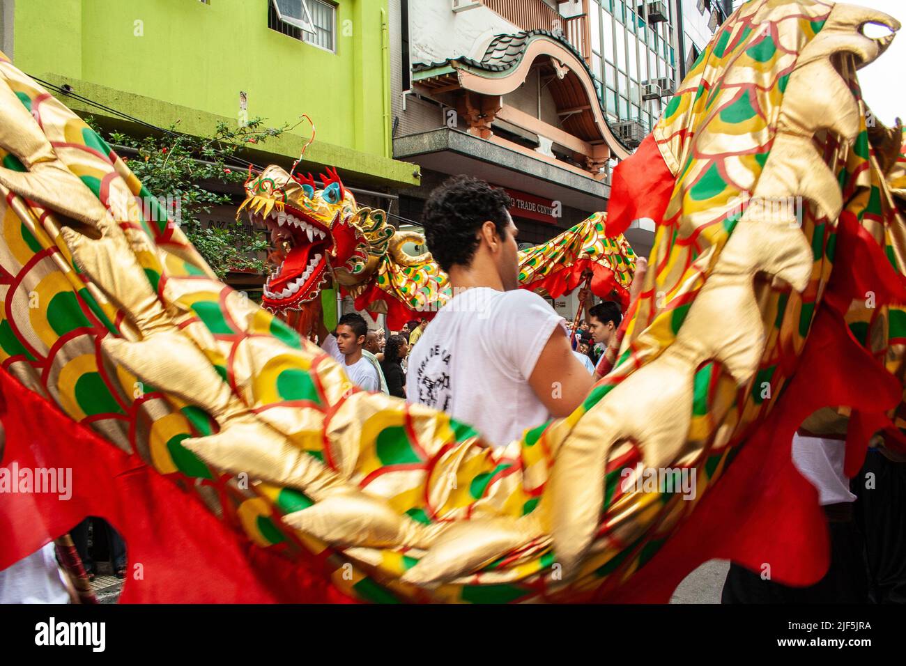 Sao Paulo, Brazil, January 26, 2008, People take part and watching lion dance in the celebration of Chinese New Year in Liberdade neighborhood, in Sao Stock Photo