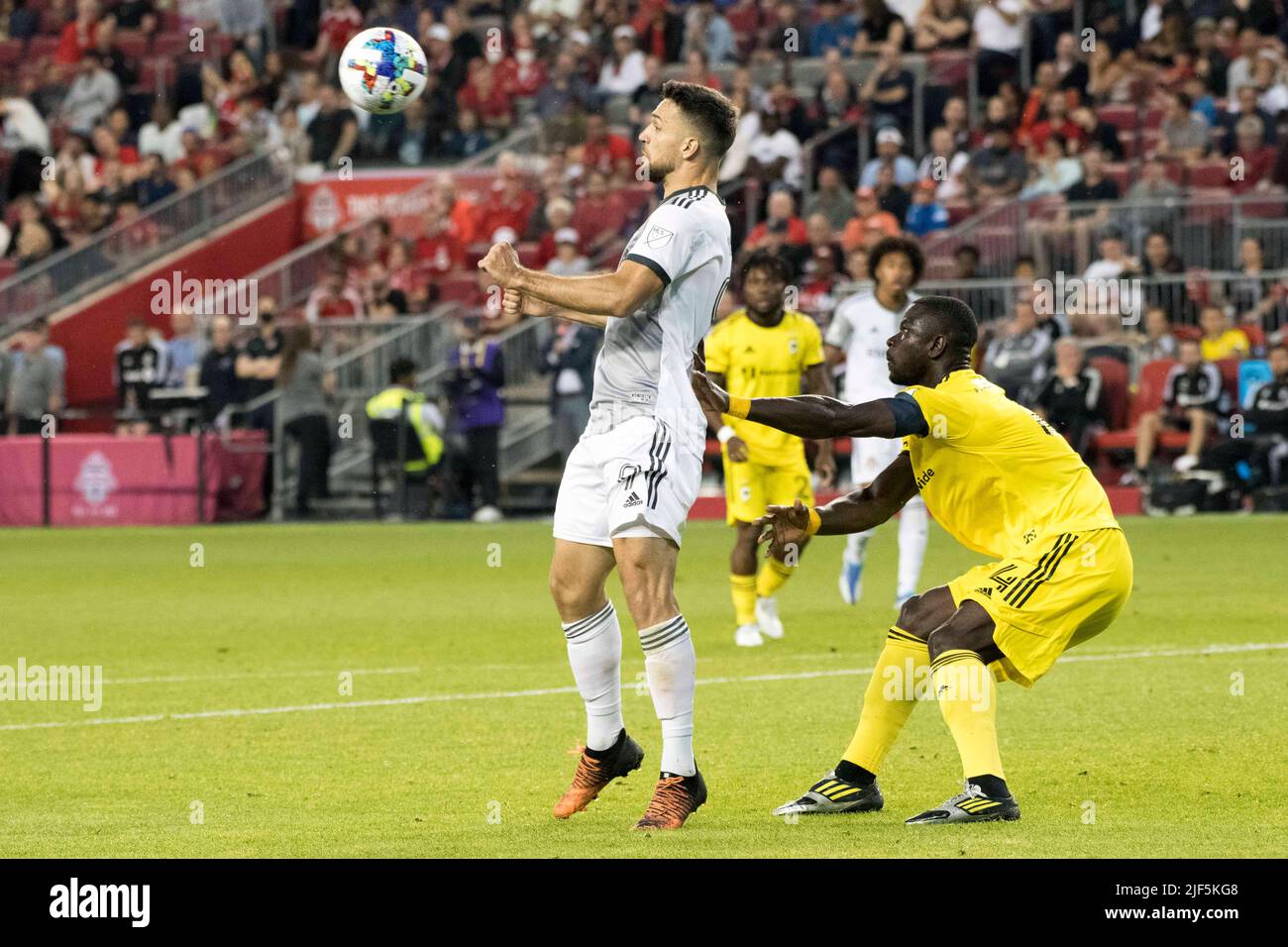 Toronto, Ontario, Canada. 29th June, 2022. Jesus Jimenez (9) and Jonathan Mensah (4) in action during the MLS game between Toronto FC and Columbus SC. The game ended 2-1 For Columbus SC. (Credit Image: © Angel Marchini/ZUMA Press Wire) Stock Photo