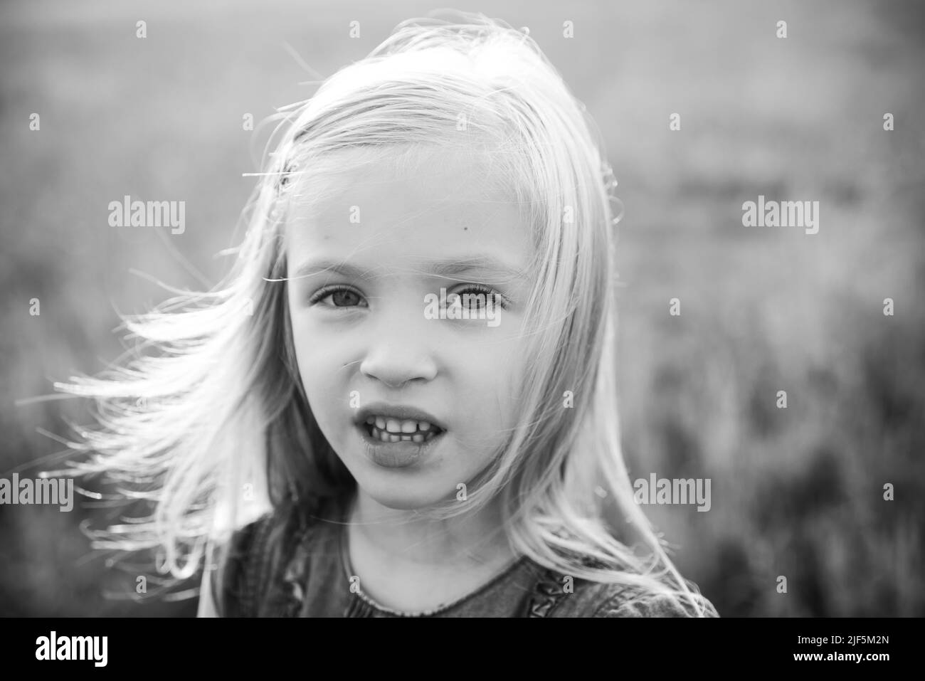 Portrait of cute blonde child girl. Portrait of angel-like child in ...