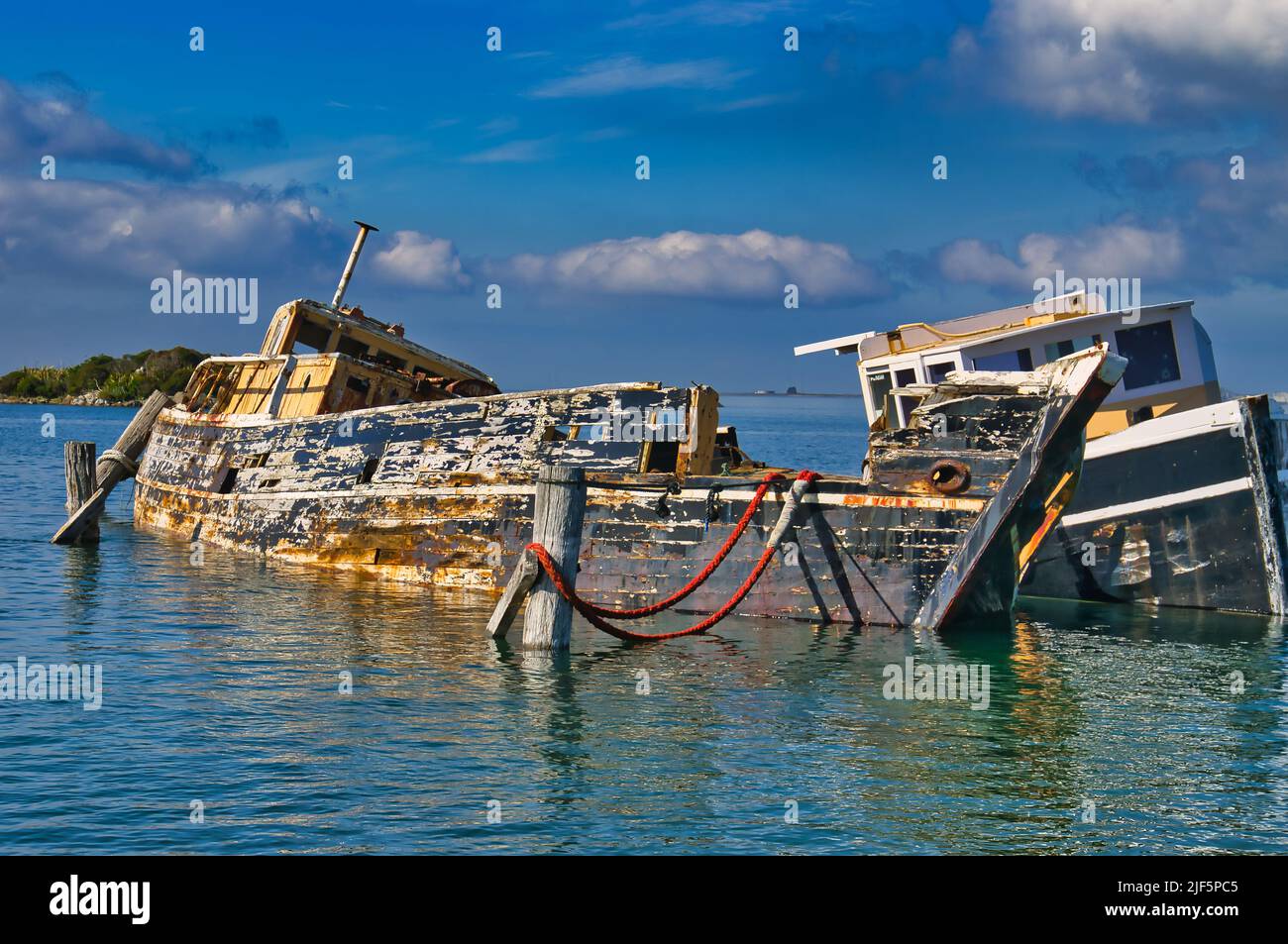 Wrecks of two wooden ships in the harbour of Bluff, South Island, New Zealand. Stock Photo