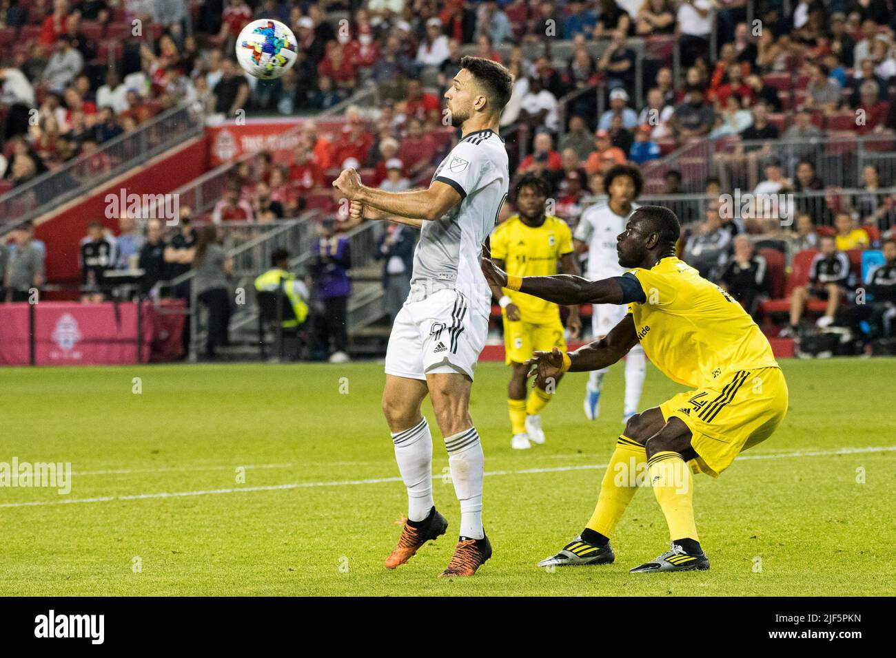 Toronto, Canada. 29th June, 2022. Jesus Jimenez (L) of Toronto and Jonathan Mensah (R) of Columbus seen in action during the MLS game between Toronto FC and Columbus SC at BMO Field. The game ended 2-1 For Columbus SC. Credit: SOPA Images Limited/Alamy Live News Stock Photo