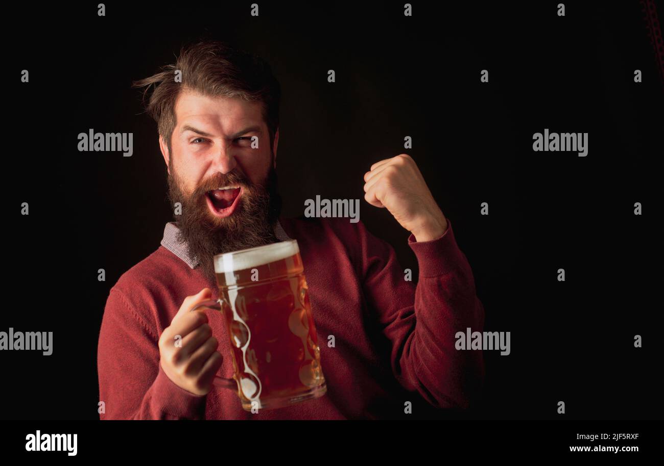Brewery concept. Happy smiling man with beer. Senior man drinking beer