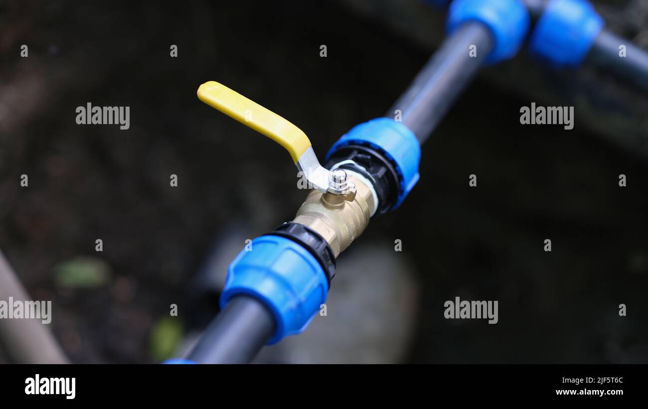 Closeup of pvc pipes with tap or faucet Stock Photo Alamy