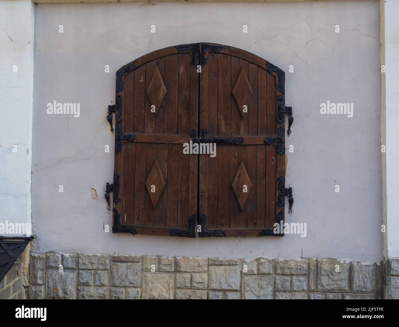 closed wooden shutters on a white wall Stock Photo - Alamy