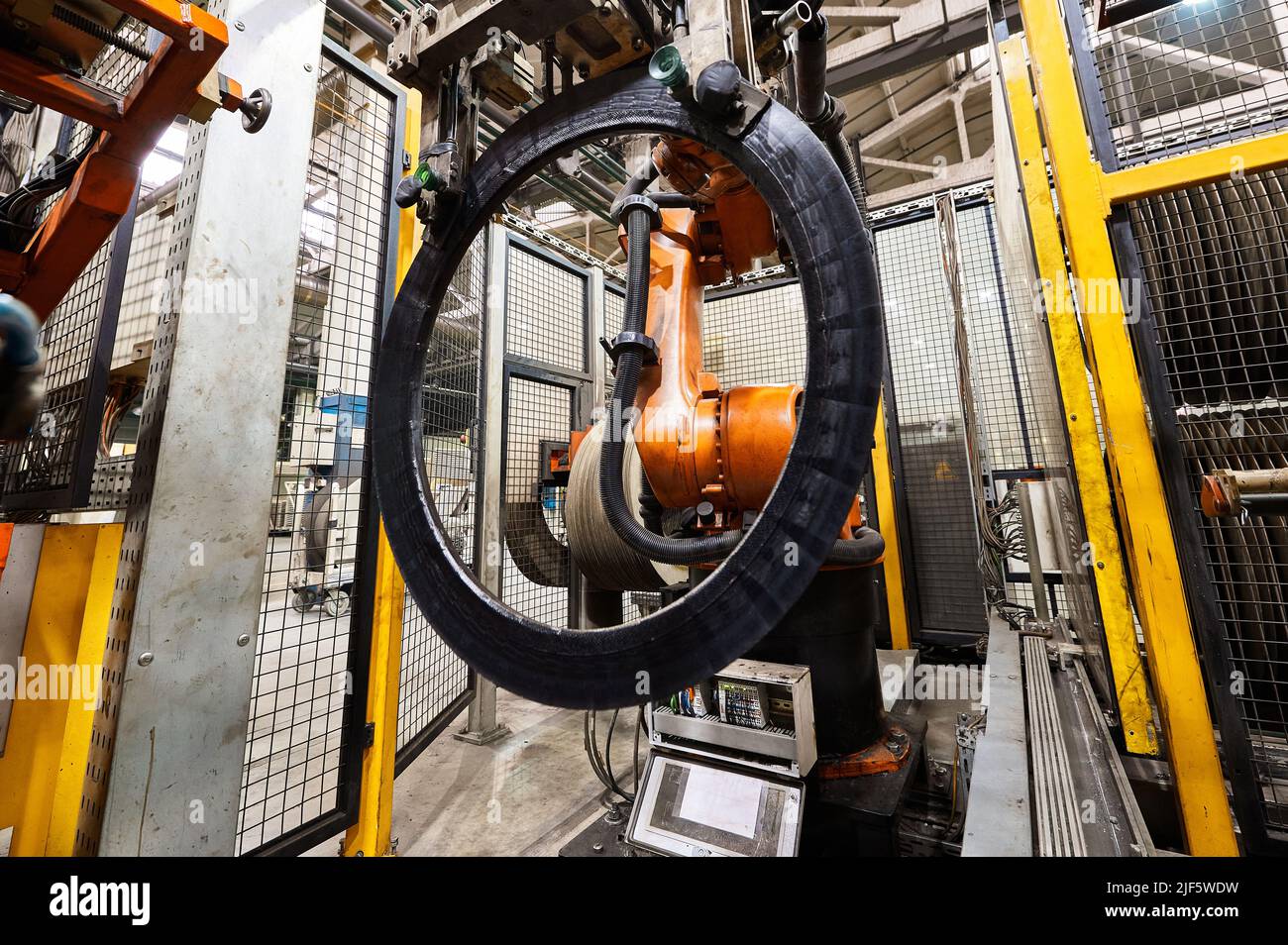 Rolling drum with rubber layers to form car tire at plant Stock Photo Alamy