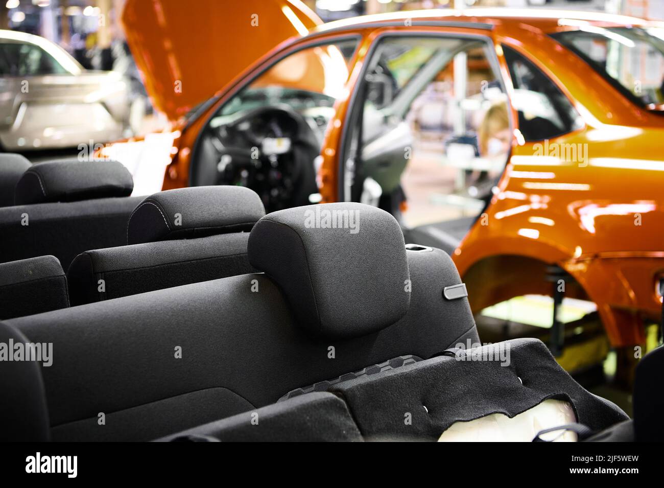 View from the cab of the car on the assembly line of the car factory. Stock Photo