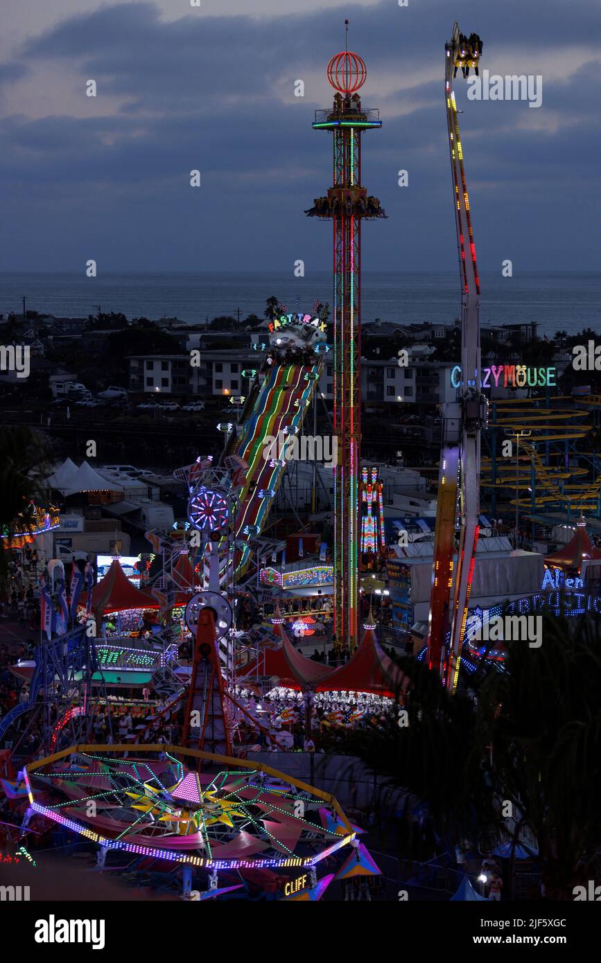 People enjoy rides at the San Diego County Fair as Americans prepare for their annual 4th of July holiday in Del Mar, California, U.S., June 29, 2022.   REUTERS/Mike Blake Stock Photo