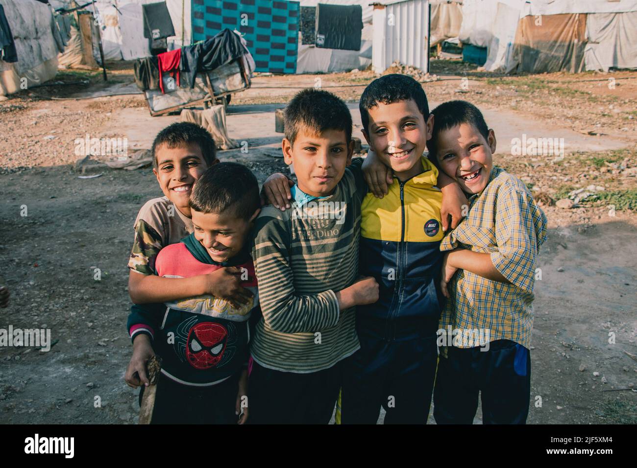 Mina, Akkar, Lebanon. 17th Nov, 2021. Syrian boys are playing together in the camp. This informal refugee camp with around 50 families is located in Akkar, north of Lebanon. In this area live the most vulnerable Syrian refugees. Some children were born in the camp. Children refugees were rarely provided with education. With that, they work with their families in the household or the field. (Photo by Lara Hauser/SOPA Images/Sipa USA) Credit: Sipa USA/Alamy Live News Stock Photo