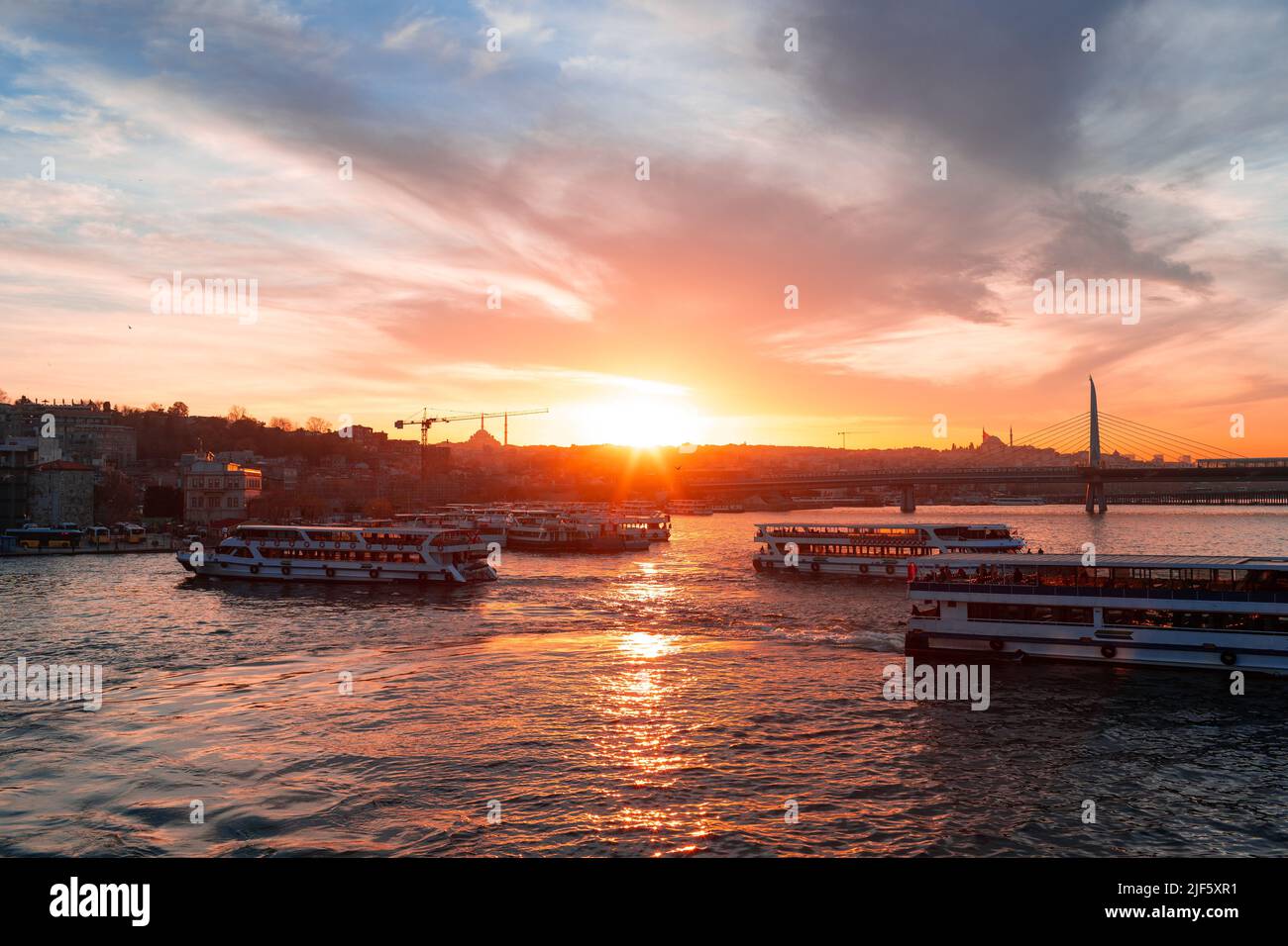 Boats in sea and scenic sunset in Istanbul Stock Photo